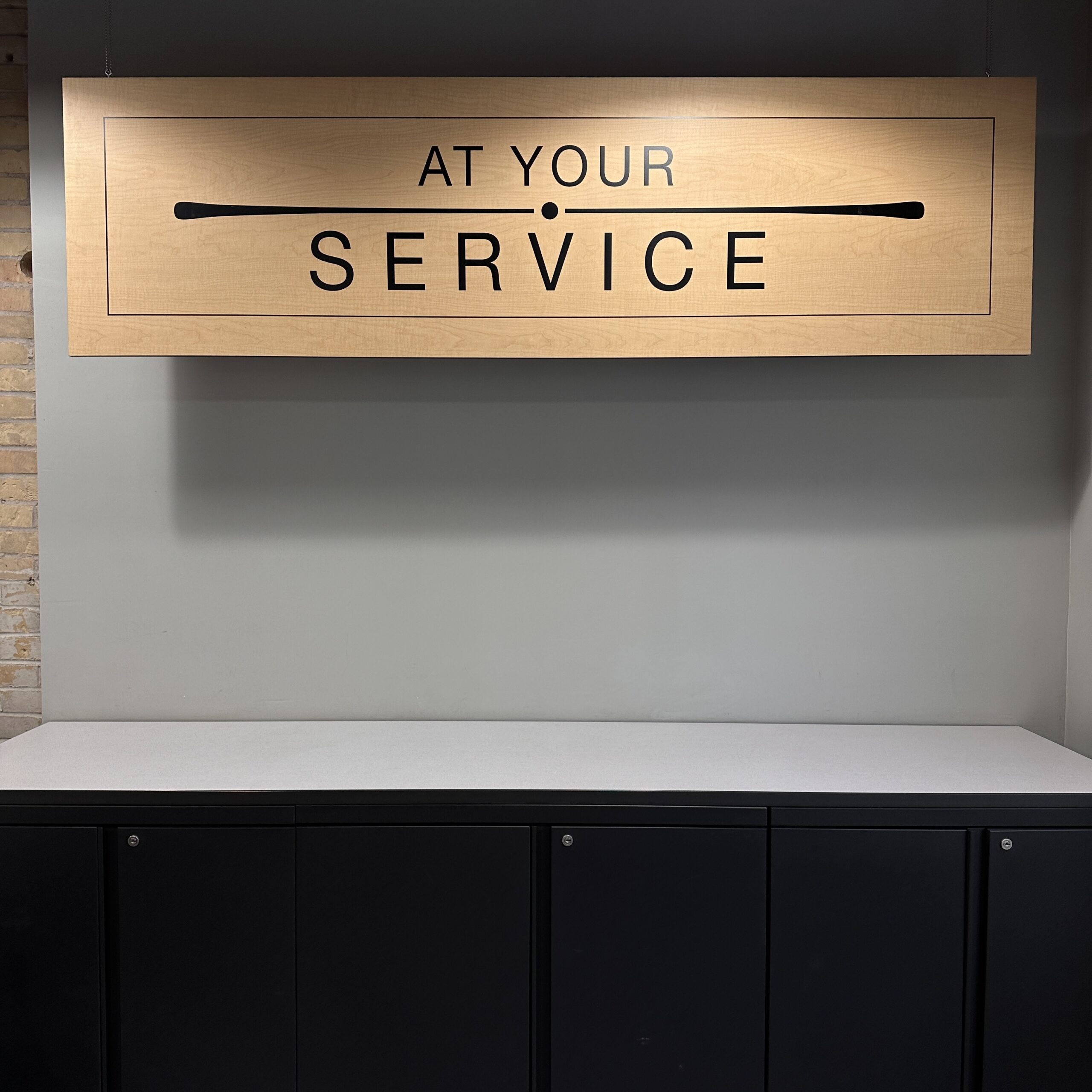 sign that says "at your service"